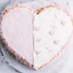 Heart-shaped cake with textured frosting.